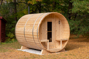 Dundalk Leisurecraft Canadian Timber Serenity Barrel Sauna in a backyard facing right