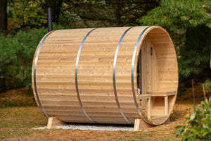 Dundalk Leisurecraft Canadian Timber Serenity Barrel Sauna in a backyard facing far right