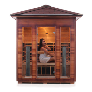 Enlighten Sauna Rustic 4 Person Peak Roof front facing view with woman inside and white background