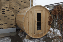 Load image into Gallery viewer, Dundalk Leisurecraft Canadian Timber Harmony Barrel Sauna outside facing right with snow on the ground