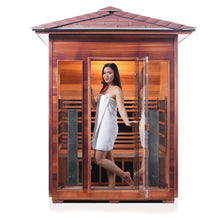 Load image into Gallery viewer, Enlighten Sauna Rustic 3 Person Peak Roof with woman inside opening the door and looking out